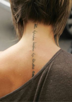 Victoria Caroline Beckham Back Tattoo